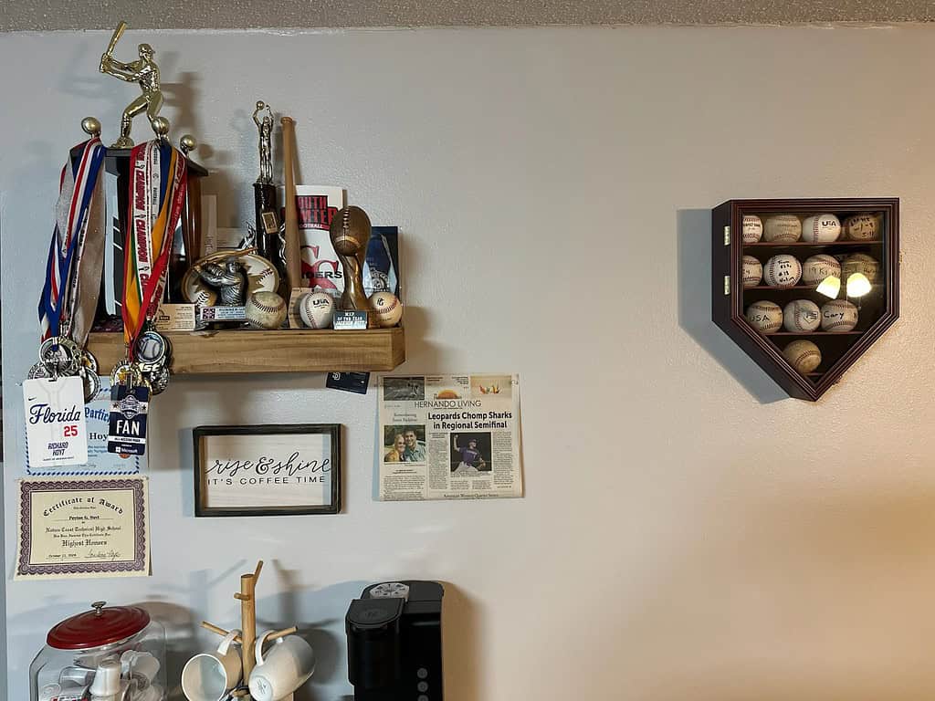 A wall covered with mementoes of Jackson Hoyt's athletic accomplishments in his father's home. [Photo courtesy of Rich Hoyt.]