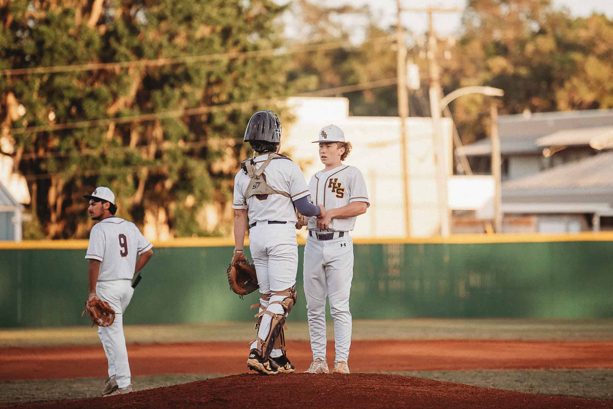 Catcher Kaine Ellis (JR) and Pitcher Cadyn Williams (JR) convene on the pitcher's mound before the game. [Photo by Cynthia Leota]