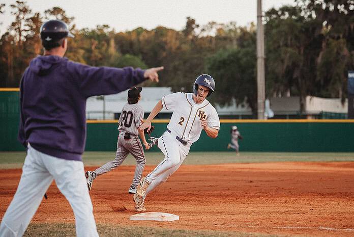 Hernando's Austin Knierim (JR) runs to home plate. [Photo by Cynthia Leota]