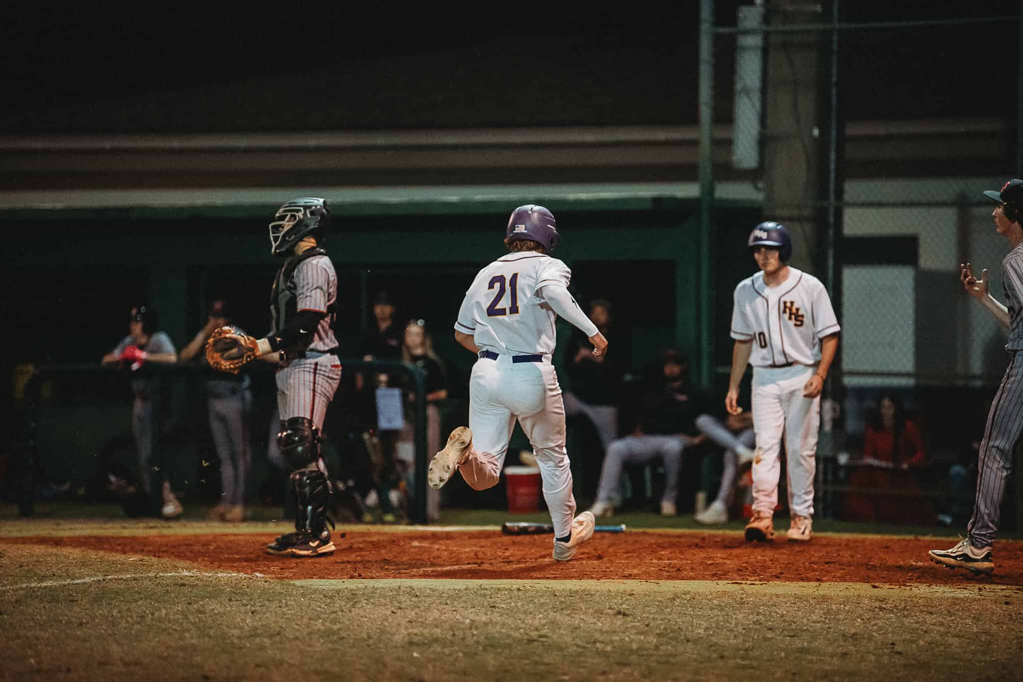 Hernando's Kaleb Russell (JR) runs to home base. [Photo by Cynthia Leota]