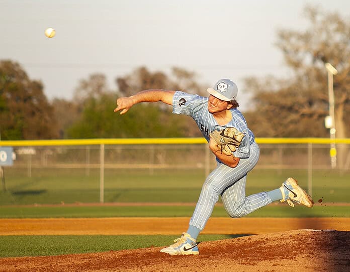 Brady Mcmurdo, 3, pitches the ball to the batter during a game at Nature Coast Technical High School in Brooksville, Fla., on Wednesday, March 19, 2025. (Photo by Hanna Maglio)