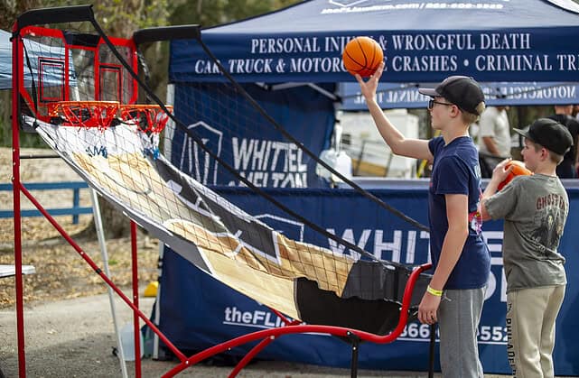 Weston Bandy shoots some hoops on Saturday at Swamp Fest. [Photo by Hanna Fox Maglio]