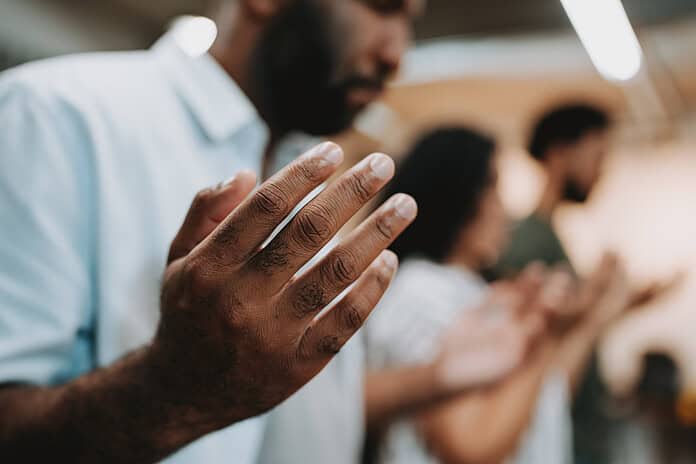 Group of people praying for mental support